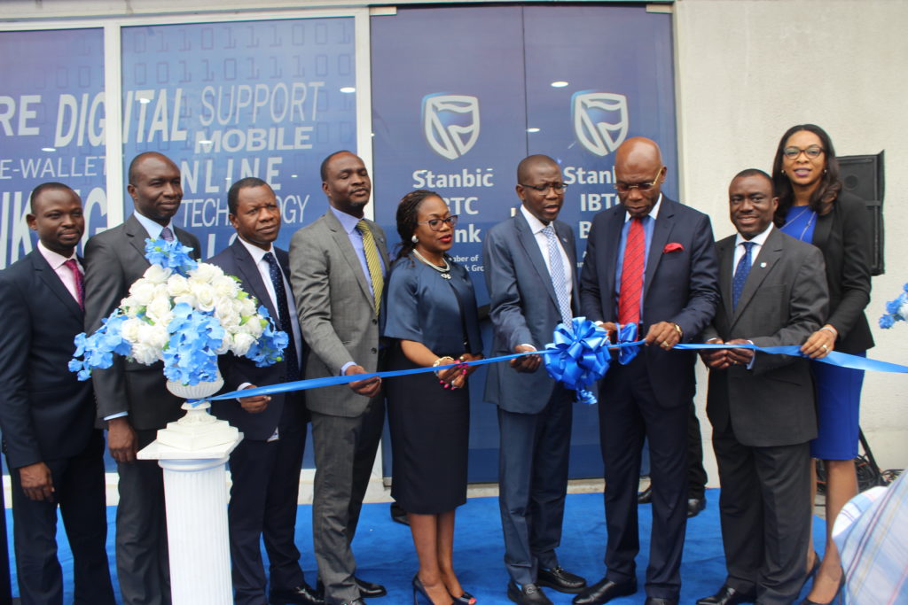  Chairman, Zinox Group, Leo Stan Ekeh (third from right) and Chief Executive Officer, Stanbic IBTC Bank, Yinka Sanni (fourth from right) perform the official cutting of the tape in the presence of other Senior Executives of Stanbic IBTC Bank at the launch of the bank's digital branch located at the Maryland Mall, along Ikorodu Road, Lagos on Wednesday December 14th 2016...