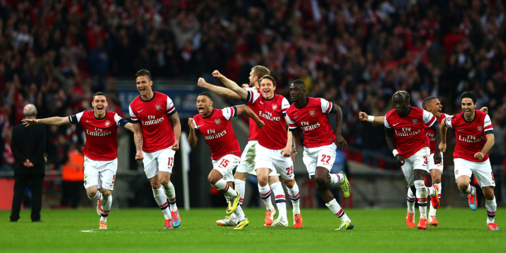 LONDON, ENGLAND - APRIL 12:  Arsenal celebrate as the win 4:2 in the penalty shoot out during the FA Cup Semi-Final match between Wigan Athletic and Arsenal at Wembley Stadium on April 12, 2014 in London, England.  (Photo by Michael Steele/Getty Images)