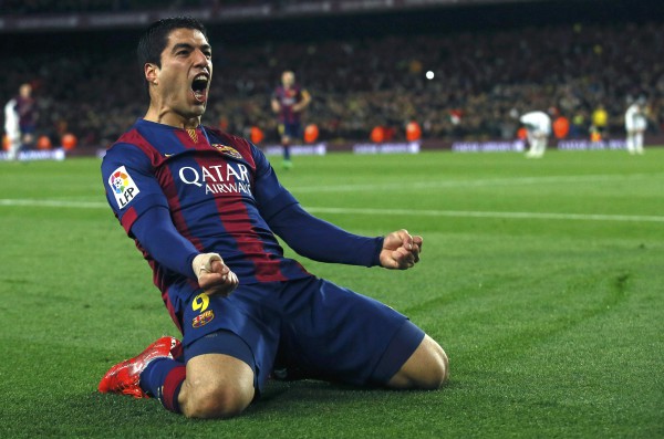 Barcelona's Luis Suarez celebrates after scoring a goal against Real Madrid during their Spanish first division "Clasico" soccer match at Camp Nou stadium in Barcelona, March 22, 2015.        REUTERS/Albert Gea