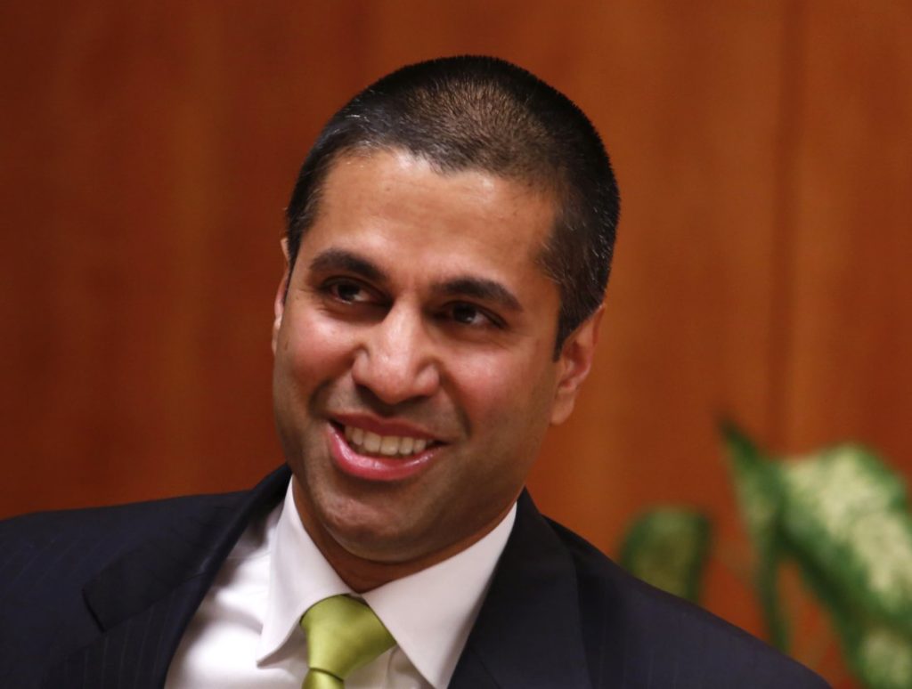 Federal Communications Commission (FCC) commissioner Ajit Pai arrives at a FCC Net Neutrality hearing in Washington February 26, 2015. The FCC is expected Thursday to approve Chairman Tom Wheeler's proposed "net neutrality" rules, regulating broadband providers more heavily than in the past and restricting their power to control download speeds on the web. REUTERS/Yuri Gripas (UNITED STATES - Tags: POLITICS SCIENCE TECHNOLOGY BUSINESS TELECOMS HEADSHOT) - RTR4RAVY