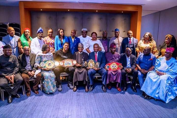 Anthony Joshua Prostrate flat to greet President Muhammadu Buhari before he presented his World heavyweight champion belt to the Nigerian President on Saturday.